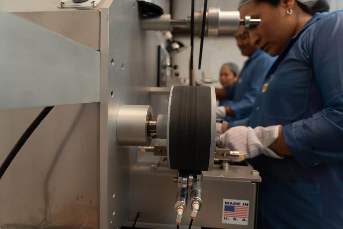 Workers on Smt Production Line Handling Leader Tape Extenders and Smd Components